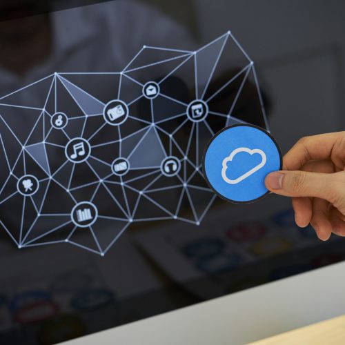 Close-up image of UI designer working on icons design for new cloud service