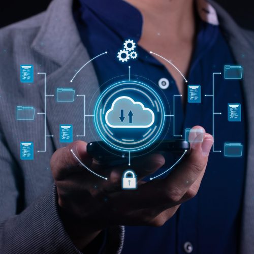 Vertical Photo of A man employs cloud-based computing on his smartphone to facilitate data transmission, storage, backup, and access